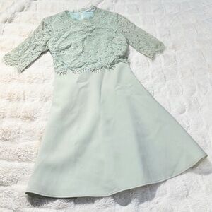 Valentino lace mini dress in mint green with three-quarter sleeves